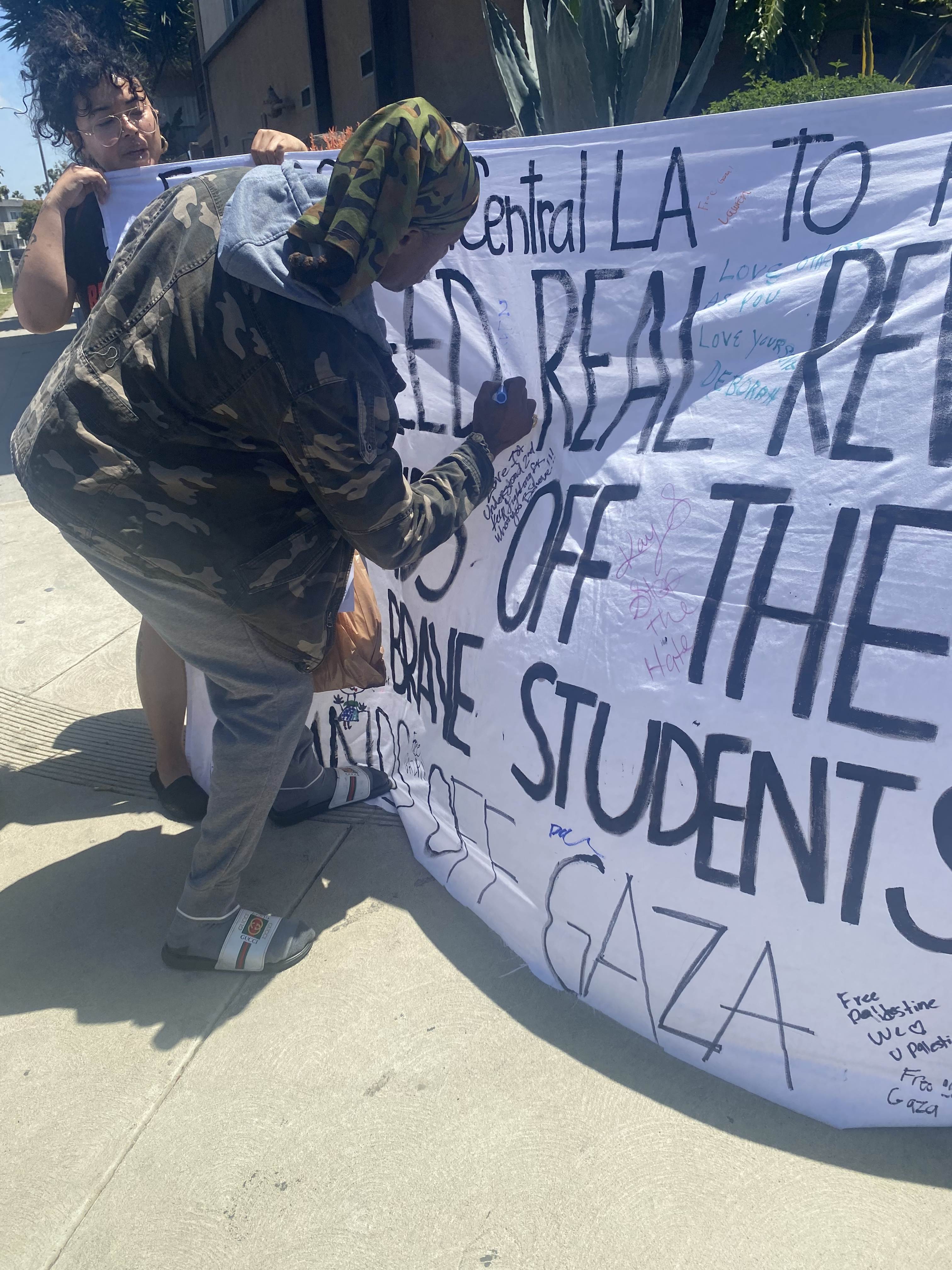 Taking Banner Supporting Protestors and Gaza to South Central Los Angeles