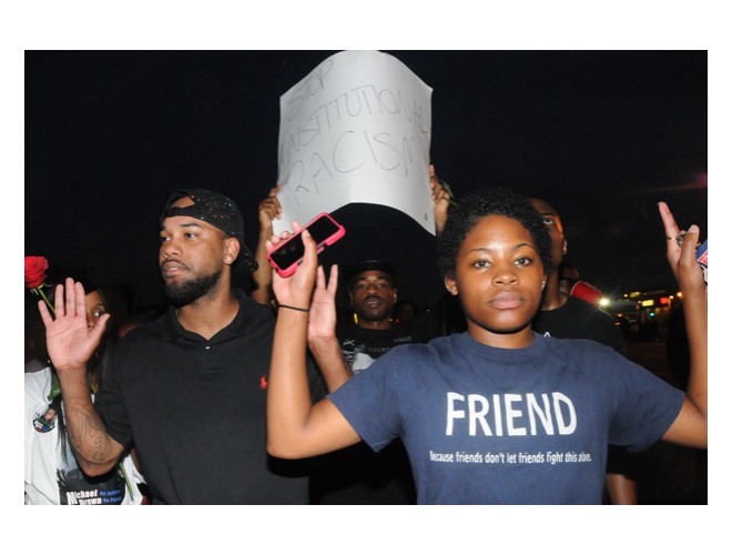 Monday night, August 18, on the ground in Ferguson. T-shirt reads: 'Friend: Because friends don't let friends fight this alone.' Photo: Li Onesto/revcom.us Monday night, August 18, on the ground in Ferguson. T-shirt reads: 'Friend: Because friends don't let friends fight this alone.' Photo: Li Onesto/revcom.us