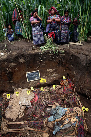 August 2007. Villagers next to mass grave of people massacred by the Guatemalan army in 1982.