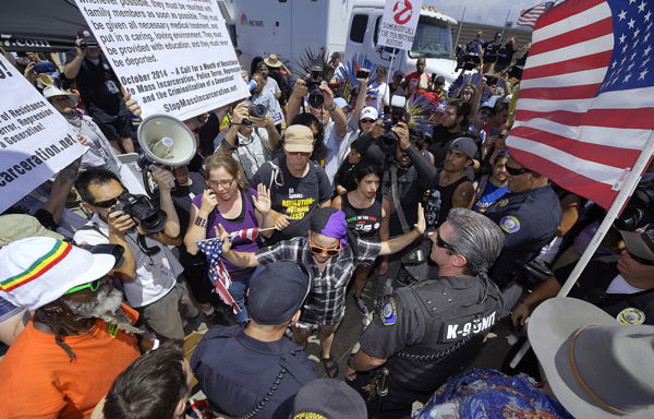 Supporters of immigrants rights face off with anti-immigrant forces in Murrieta, CA, July 4.