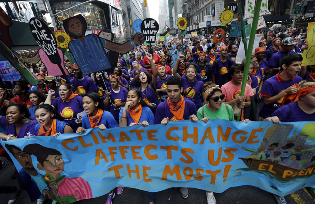 People's climate march sept 21 2014 - Banner reads CLIMATE CHANGE AFFECTS US MOST 