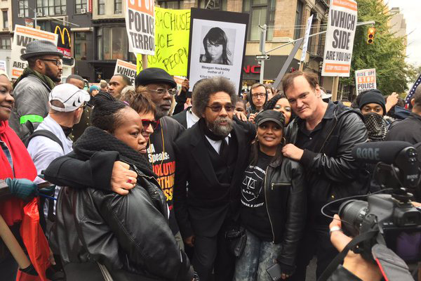Eve Ensler, Carl Dix, Cornel West, and Quentin Tarantino march with families representing people murdered by police