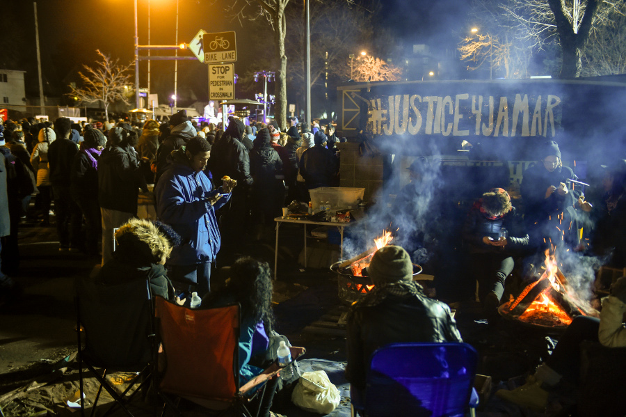 Demonstrators camp outside Minneapolis Police Department’s 4th Precinct during a protest of the police murder of Jamar Clark, November 24. AP photo