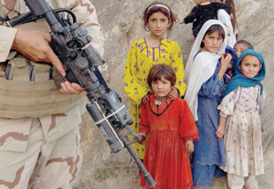 U.S. soldier and young women in Afghanistan, 2004.