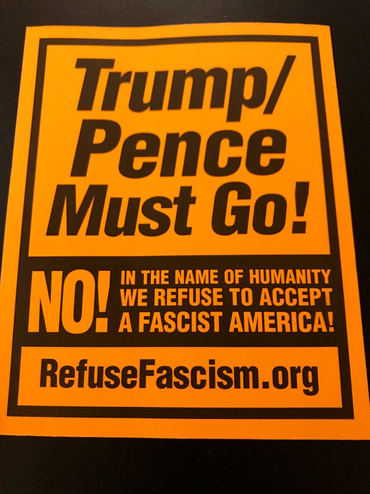 Orange stickers 'Trump/Pence Must Go'