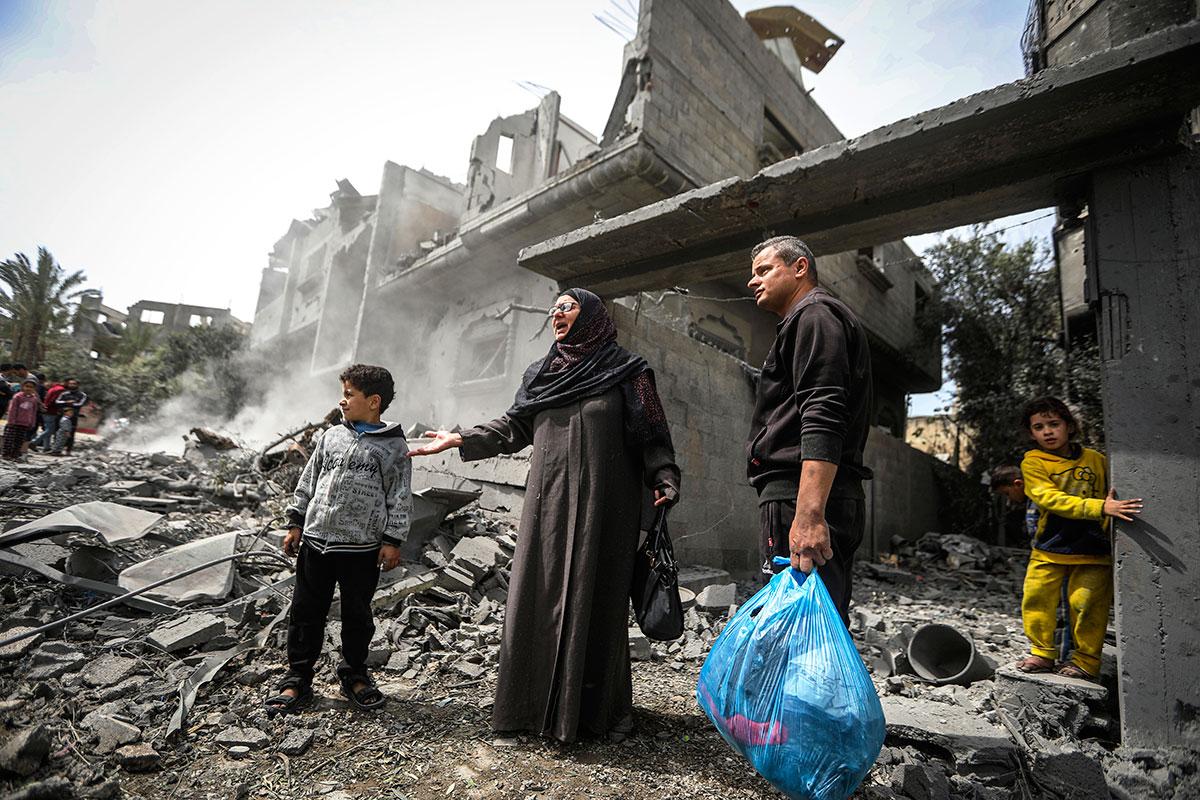 Gaza Strip: Palestinians search the rubble of a residential building in Maghazi refugee camp destroyed by Israeli airstrike, March 29, 2024.