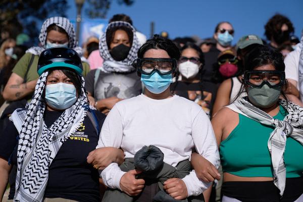 Pro-Palestinian demonstrators form a human chain on the UCLA campus, Los Angeles, May 1, 2024.