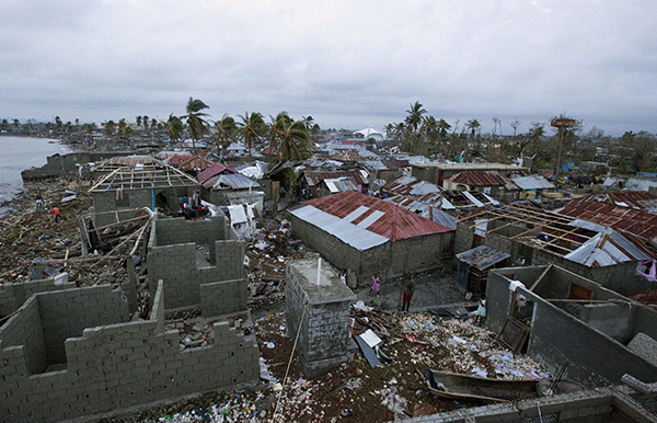 The main blow of Hurricane Matthew fell on the narrow Turibon Peninsula that stretches like a finger from Haiti’s southeastern border with the Dominican Republic west into the Caribbean Sea. In Les Cayes, in this area, homes lay in ruins, October 6. (Photo: AP)
