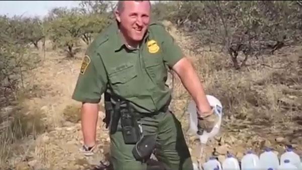 border-agent-pouring-out-water.jpg